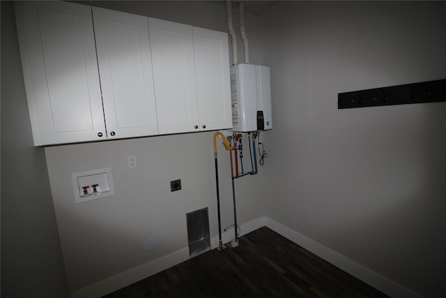 506 Mountain View Dr, Cascade, MT 59421 - washroom with cabinet space, dark wood-style floors, electric dryer hookup, tankless water heater, and hookup for a washing machine
