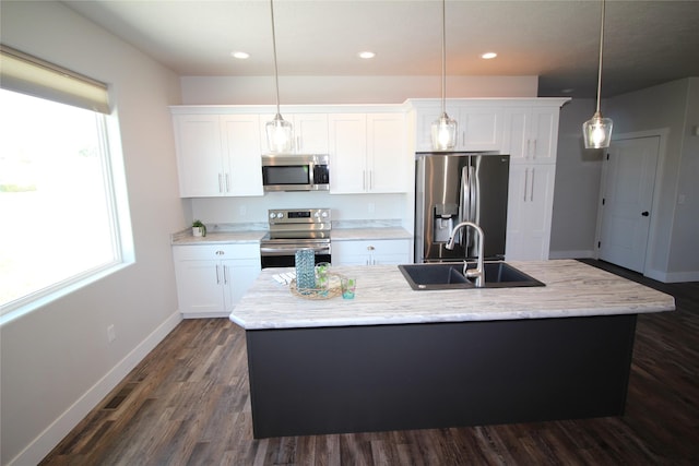 506 Mountain View Dr, Cascade, MT 59421 - kitchen with stainless steel appliances, a kitchen island with sink, white cabinetry, dark wood-style flooring, and recessed lighting