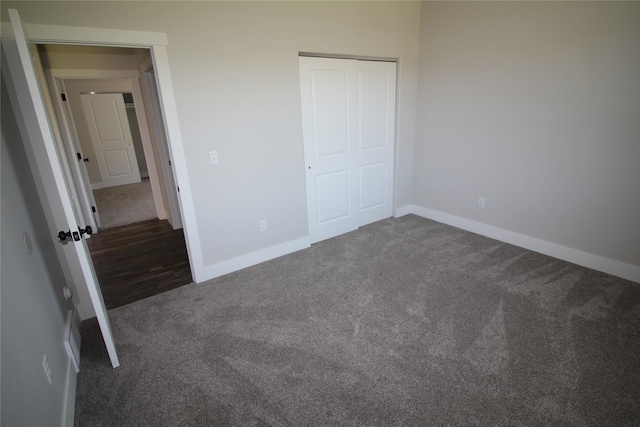 506 Mountain View Dr, Cascade, MT 59421 - unfurnished bedroom featuring dark colored carpet and a closet