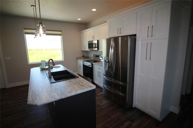 506 Mountain View Dr, Cascade, MT 59421 - kitchen with stainless steel appliances, dark wood-style floors, a kitchen island with sink, recessed lighting, and white cabinetry
