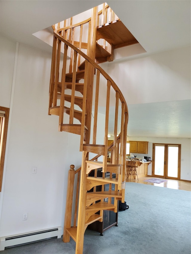 650 Hollibaugh Rd, Stevensville, MT 59870 - stairway featuring a baseboard radiator, carpet flooring, and french doors