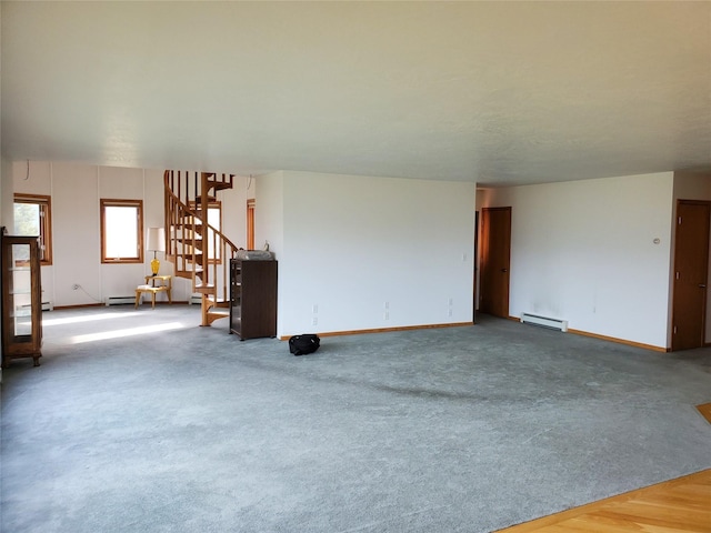 650 Hollibaugh Rd, Stevensville, MT 59870 - unfurnished living room with stairs and a baseboard radiator