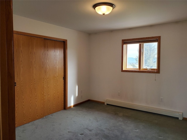 650 Hollibaugh Rd, Stevensville, MT 59870 - unfurnished bedroom with a baseboard radiator, carpet floors, and a closet