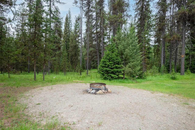 6343 Packer Creek Rd, Haugan, MT 59842 - view of yard with an outdoor fire pit and a view of trees