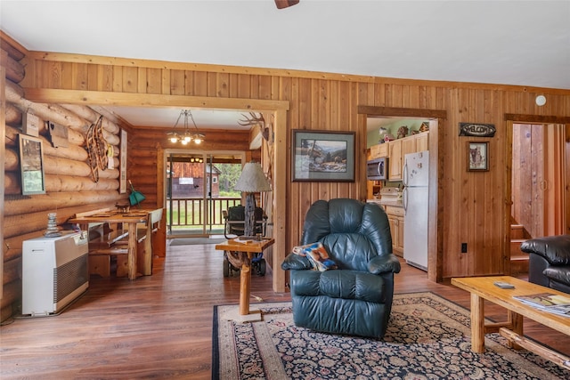 6343 Packer Creek Rd, Haugan, MT 59842 - living area with light wood-style floors and log walls