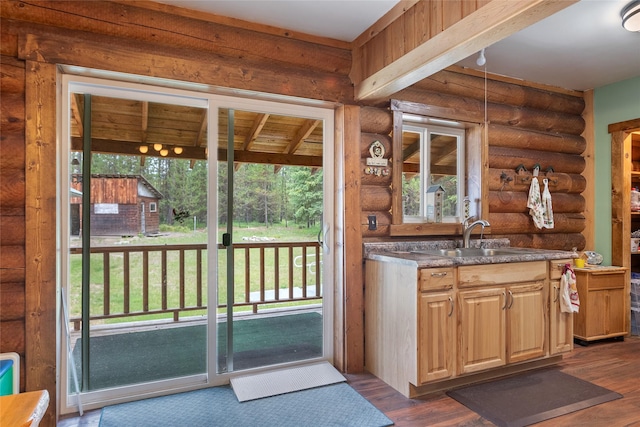 6343 Packer Creek Rd, Haugan, MT 59842 - bar with plenty of natural light, log walls, and dark wood-style flooring