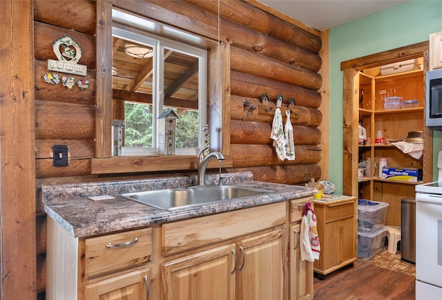 6343 Packer Creek Rd, Haugan, MT 59842 - kitchen with rustic walls, white electric stove, dark wood-type flooring, and stainless steel microwave