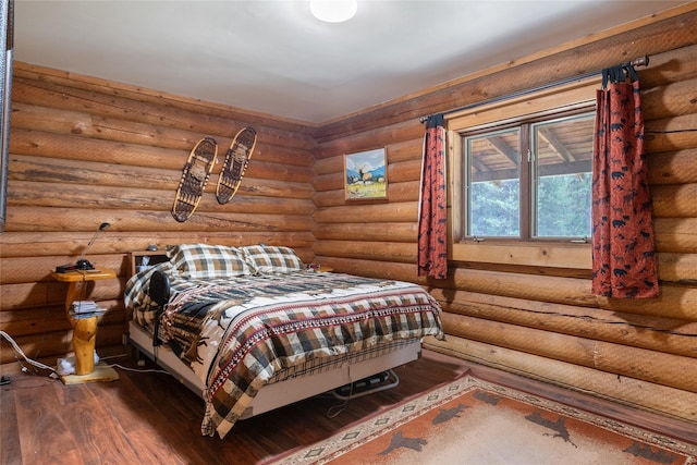 6343 Packer Creek Rd, Haugan, MT 59842 - bedroom with dark wood-type flooring and log walls