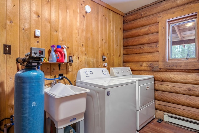 6343 Packer Creek Rd, Haugan, MT 59842 - washroom featuring a baseboard radiator, washer and dryer, log walls, and wood finished floors