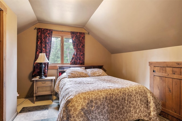 6343 Packer Creek Rd, Haugan, MT 59842 - bedroom featuring vaulted ceiling and baseboards