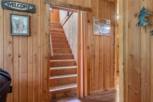 6343 Packer Creek Rd, Haugan, MT 59842 - staircase featuring wooden walls and wood finished floors