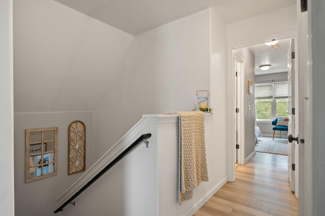 2331 W Sussex Ave, Missoula, MT 59801 - hall featuring light wood-type flooring and an upstairs landing