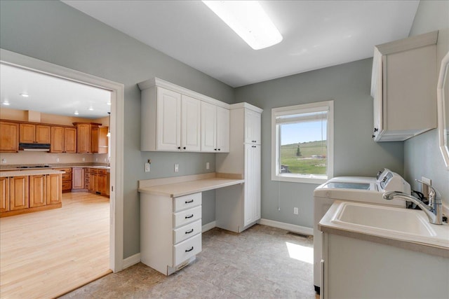40 Butch Cassidy Loop, Great Falls, MT 59405 - laundry area with cabinet space, an office area, and independent washer and dryer
