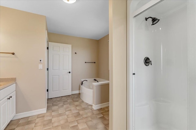 40 Butch Cassidy Loop, Great Falls, MT 59405 - bathroom with vanity, a bath, a shower stall, and tile patterned floors