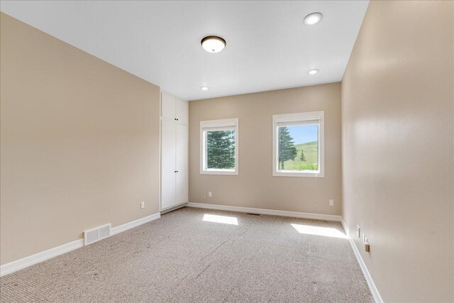 40 Butch Cassidy Loop, Great Falls, MT 59405 - unfurnished room with light colored carpet and recessed lighting