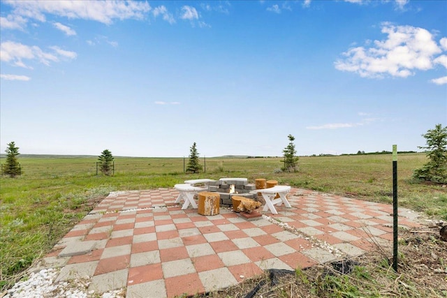 40 Butch Cassidy Loop, Great Falls, MT 59405 - view of patio / terrace featuring a rural view and an outdoor fire pit