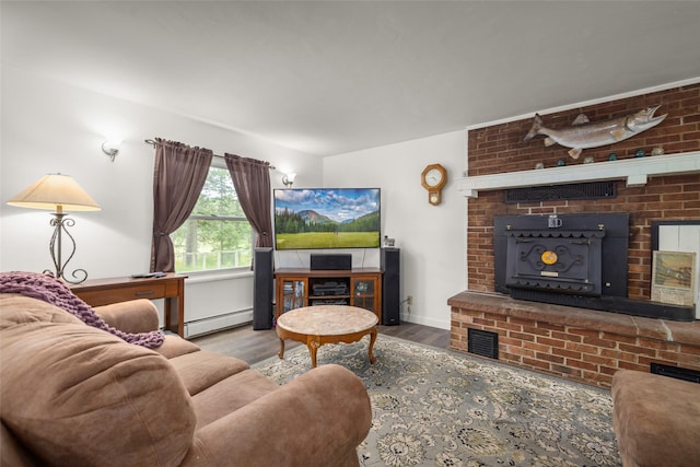155 Lake Peter Ct, Kalispell, MT 59901 - living area featuring baseboard heating, wood finished floors, and a fireplace