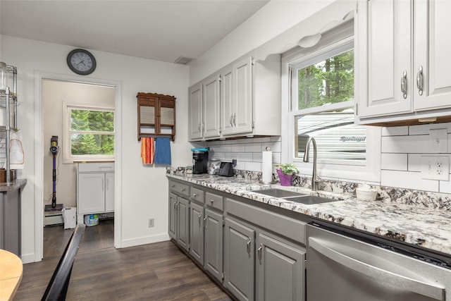 155 Lake Peter Ct, Kalispell, MT 59901 - kitchen with stainless steel dishwasher, gray cabinetry, dark wood-type flooring, and backsplash