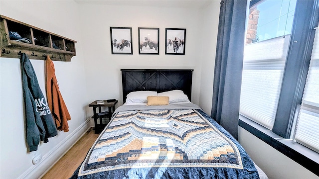 101 W Quartz St Unit 1A, Butte, MT 59701 - bedroom featuring wood finished floors and baseboards