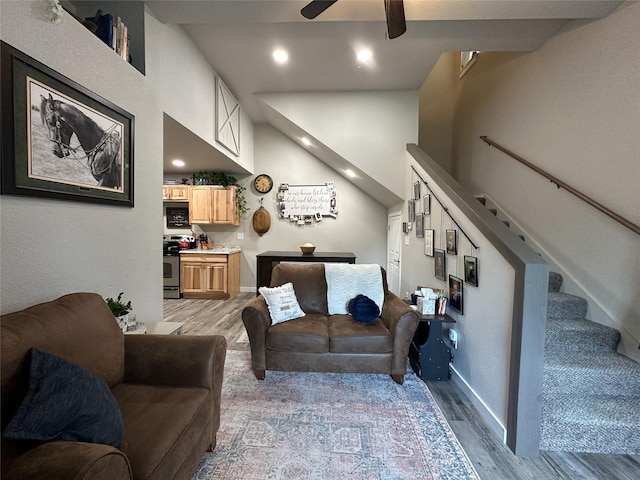 86 Steamboat Way W, Thompson Falls, MT 59873 - living area featuring wood finished floors, ceiling fan, and stairway