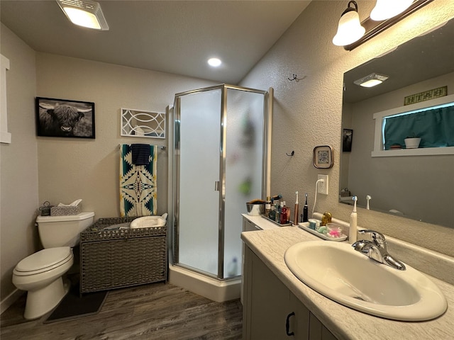 86 Steamboat Way W, Thompson Falls, MT 59873 - full bathroom with wood finished floors, vanity, a shower stall, and a textured wall