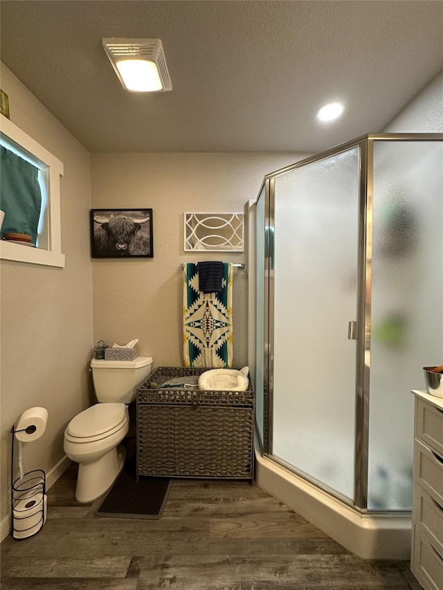 86 Steamboat Way W, Thompson Falls, MT 59873 - bathroom with wood finished floors, a stall shower, vanity, and recessed lighting