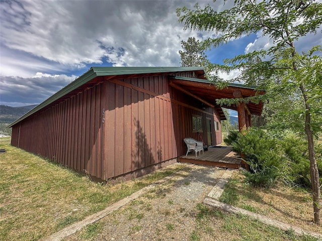 86 Steamboat Way W, Thompson Falls, MT 59873 - view of side of home featuring board and batten siding and a wooden deck