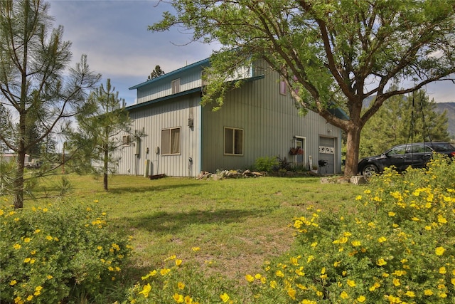 86 Steamboat Way W, Thompson Falls, MT 59873 - view of home's exterior featuring a lawn