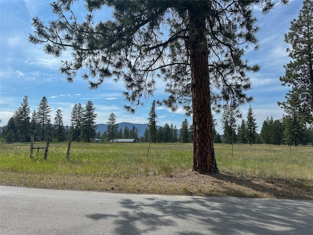 86 Steamboat Way W, Thompson Falls, MT 59873 - view of asphalt street featuring a mountain view and a rural view