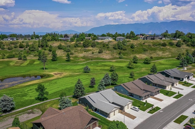 281 W Nicklaus Ave, Kalispell, MT 59901 - aerial perspective of suburban area with a mountain backdrop and a golf club
