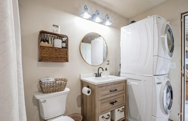 1210 Grand Fir Rd, Bigfork, MT 59911 - bathroom featuring stacked washer / dryer and vanity
