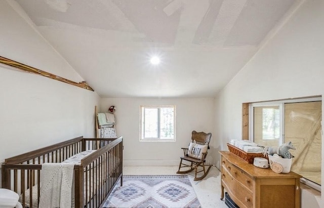 1210 Grand Fir Rd, Bigfork, MT 59911 - bedroom with vaulted ceiling and a crib