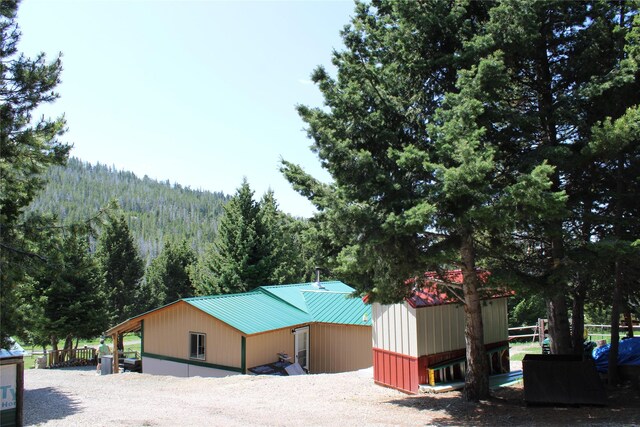 6570 Blossburg Rd, Canyon Creek, MT 59633 - view of building exterior with a wooded view