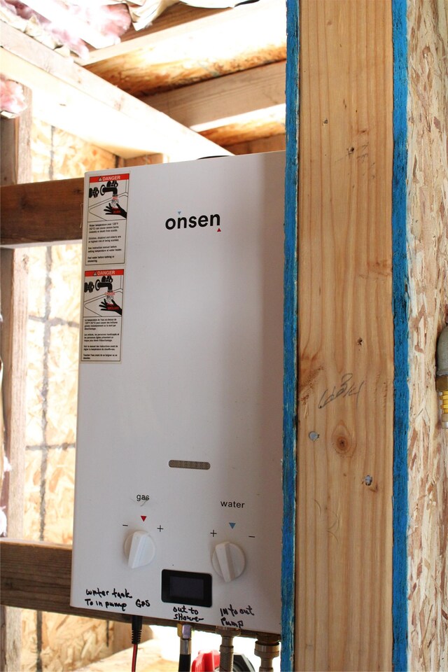6570 Blossburg Rd, Canyon Creek, MT 59633 - utility room with tankless water heater