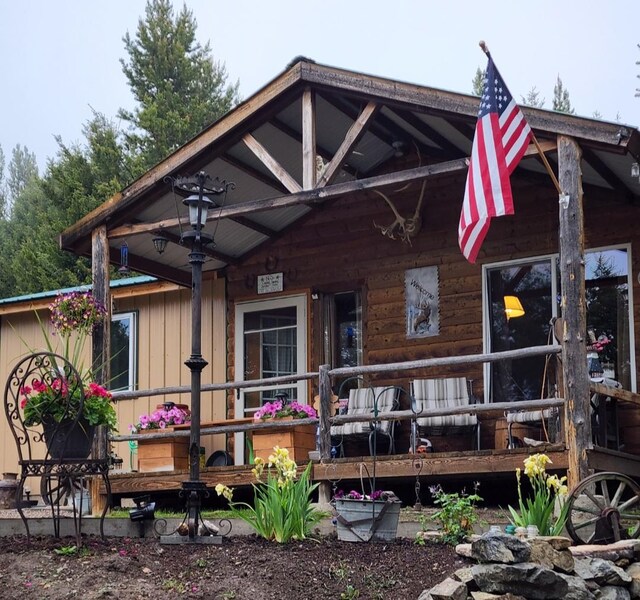 6570 Blossburg Rd, Canyon Creek, MT 59633 - back of property featuring a porch