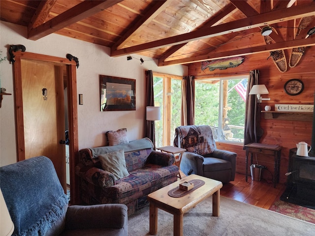 6570 Blossburg Rd, Canyon Creek, MT 59633 - living area with hardwood / wood-style floors, wooden ceiling, a wood stove, and wooden walls