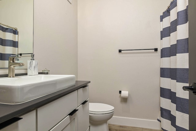 6170 Elysian Rd Unit 103-203, Billings, MT 59101 - bathroom with vanity, wood finished floors, and a shower with shower curtain