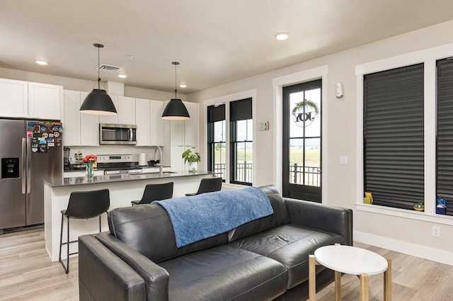 6170 Elysian Rd Unit 103-203, Billings, MT 59101 - living area featuring light wood-style floors and recessed lighting