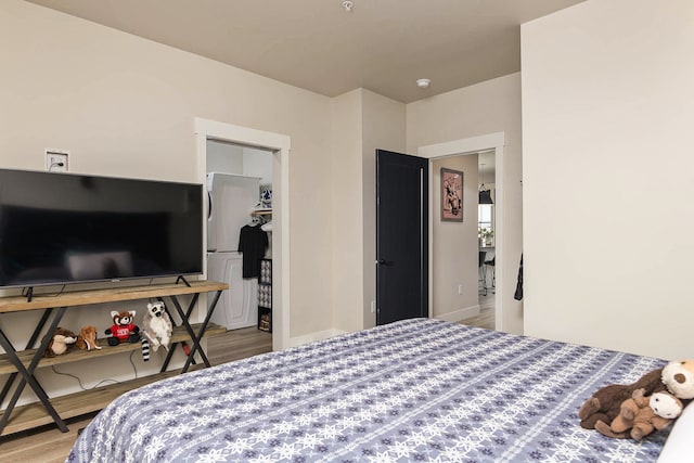 6170 Elysian Rd Unit 103-203, Billings, MT 59101 - bedroom with wood finished floors and a walk in closet