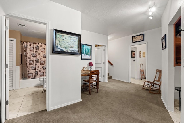 6350 S Meadowwood Ln, Missoula, MT 59803 - hall with stairway, light tile patterned flooring, and light carpet