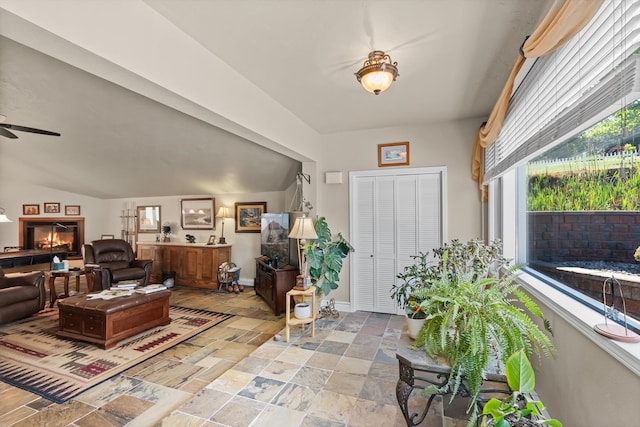 6350 S Meadowwood Ln, Missoula, MT 59803 - living area with ceiling fan, stone tile floors, and plenty of natural light