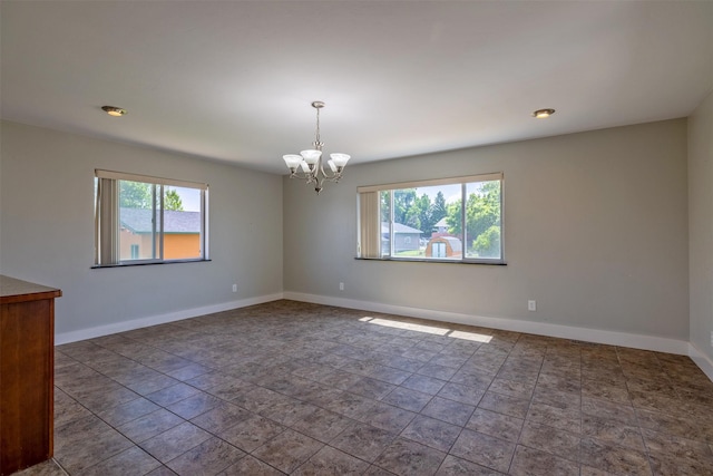 701 E Lewis St, East Helena, MT 59635 - unfurnished room featuring a chandelier and stone finish flooring