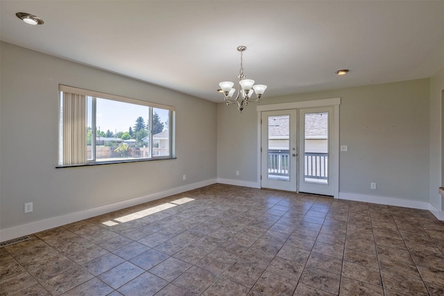 701 E Lewis St, East Helena, MT 59635 - unfurnished room with plenty of natural light and a chandelier