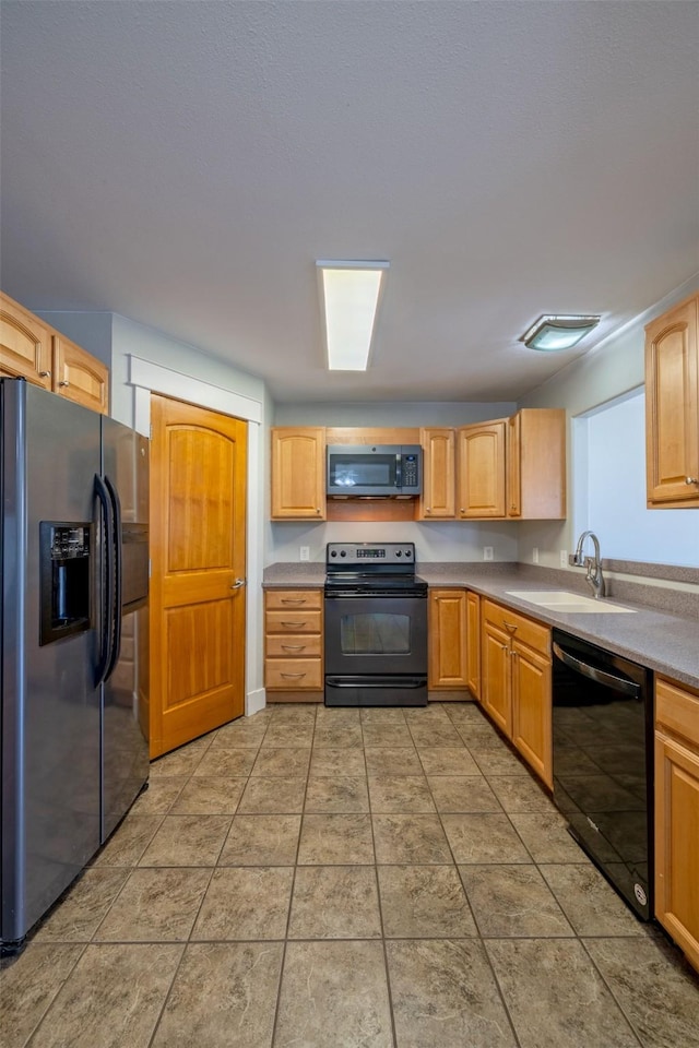 701 E Lewis St, East Helena, MT 59635 - kitchen featuring black appliances and a sink