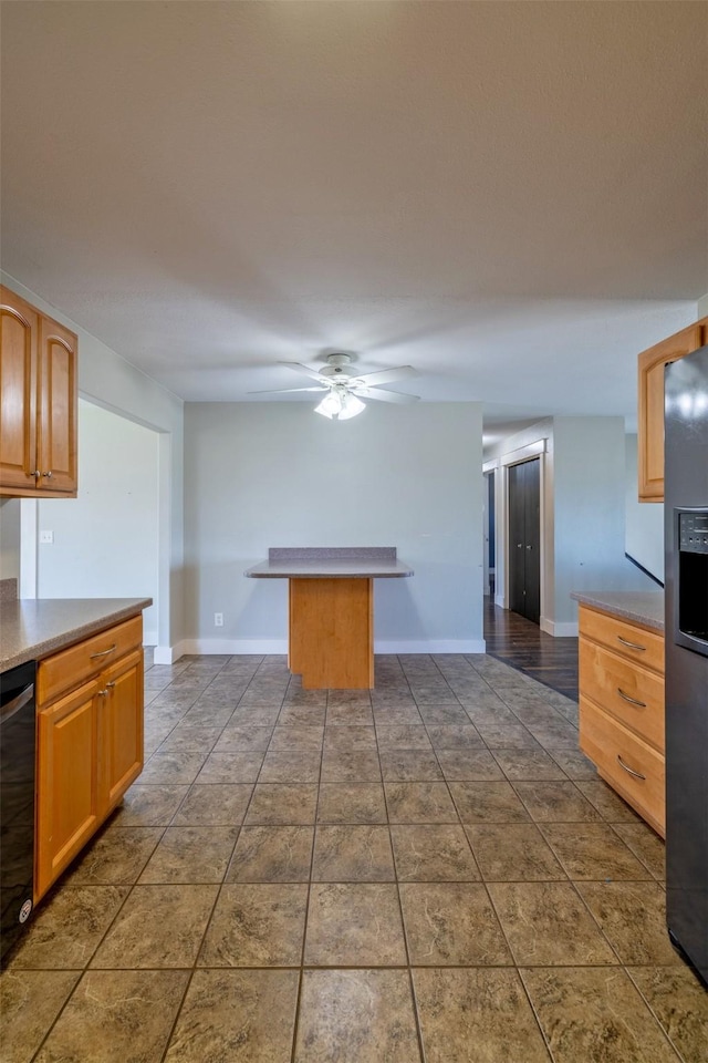 701 E Lewis St, East Helena, MT 59635 - kitchen featuring ceiling fan and stainless steel fridge