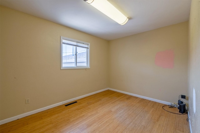 701 E Lewis St, East Helena, MT 59635 - spare room featuring light wood-style flooring and baseboards