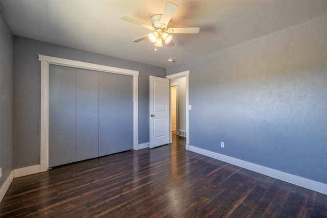 701 E Lewis St, East Helena, MT 59635 - unfurnished bedroom featuring wood finished floors, a closet, and a ceiling fan