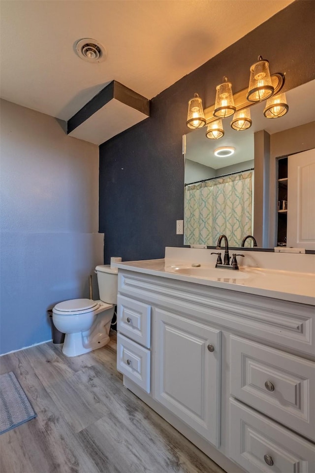 701 E Lewis St, East Helena, MT 59635 - bathroom featuring vanity and wood finished floors