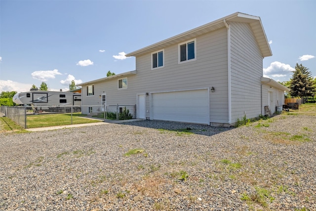 701 E Lewis St, East Helena, MT 59635 - back of house with a garage and driveway
