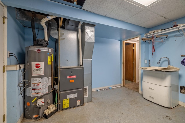 701 E Lewis St, East Helena, MT 59635 - utility room featuring water heater and heating unit